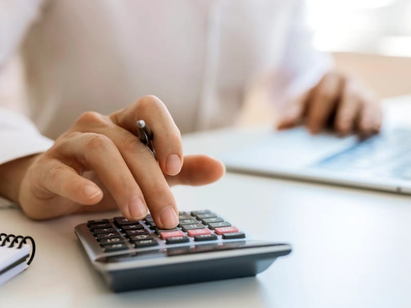 Tax forms and calculator on a desk